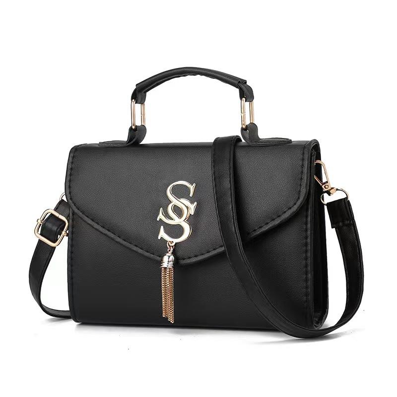 CASSANDRA Medium top handle bag in grain de poudre embossed leather Black | Womens Top Handles